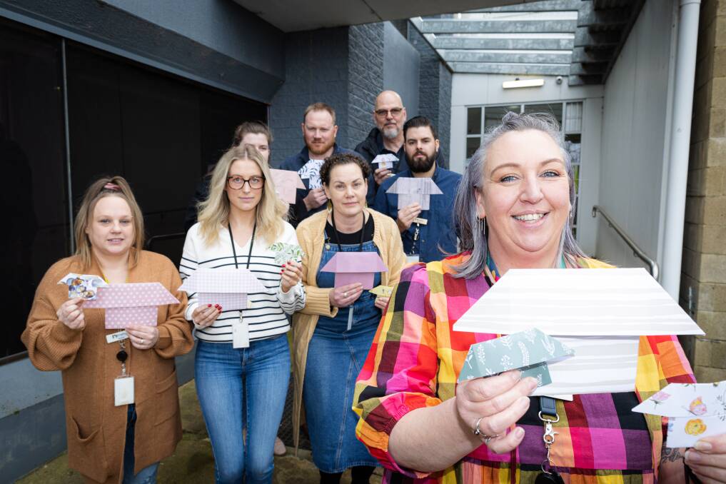 Brophy Housing Support and Linkages manager Leah McDonald (right) and members of the Southwest Victoria Homelessness Network team hold some of the origami houses which will be presented to parliament. Picture by Sean McKenna