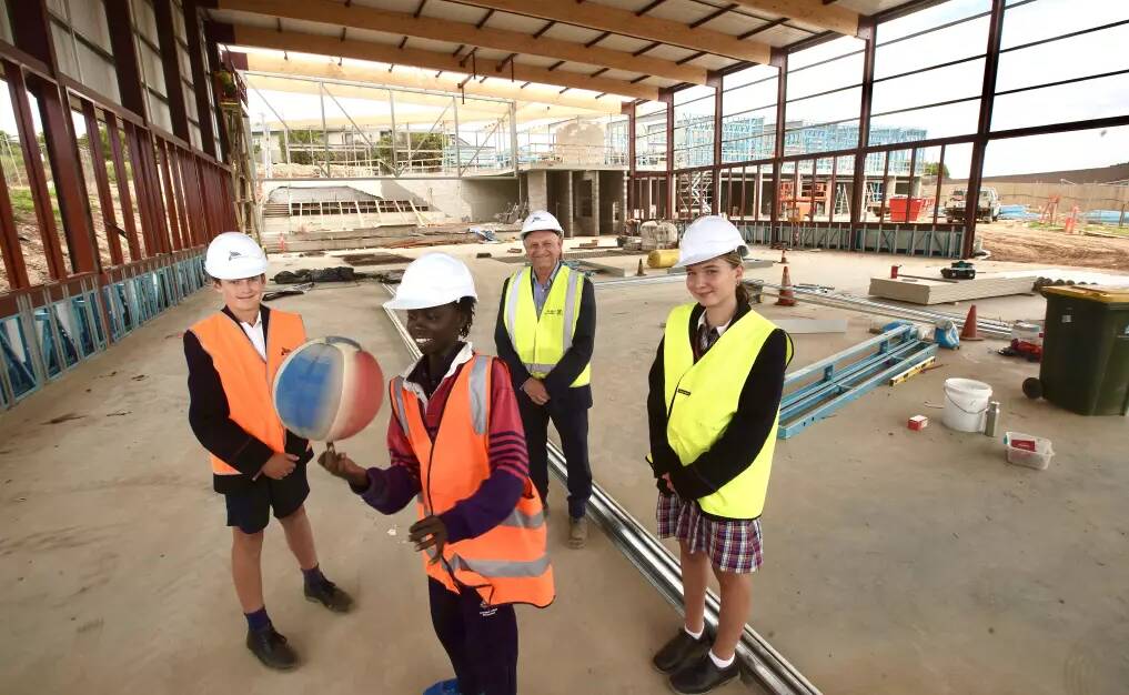 Monty Darcy, Gano Akoch, principal Peter Morgan and Ruby Koch check out the new Edmund Rice Centre at Emmanuel College. Picture supplied