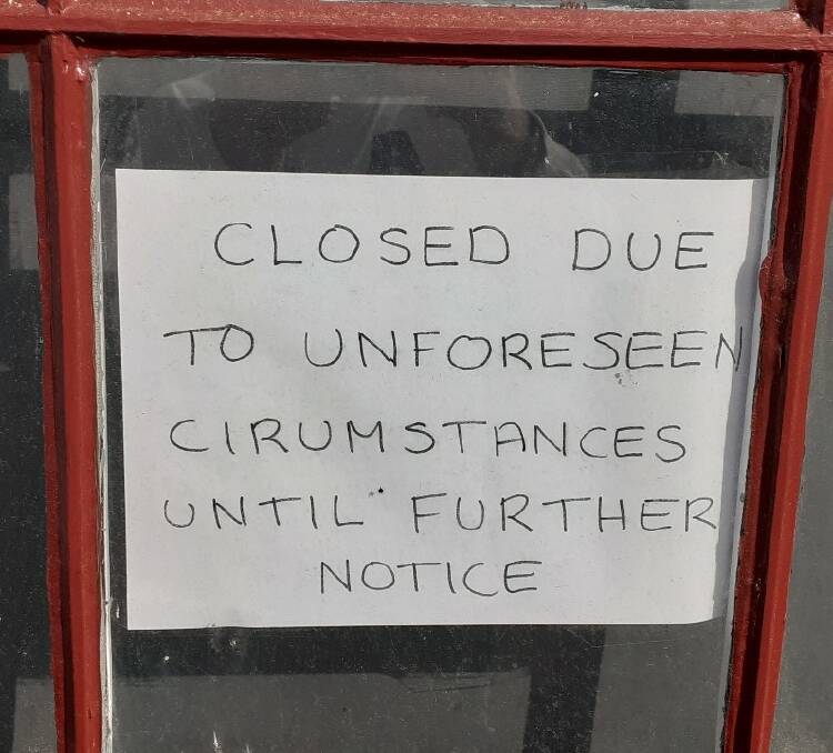 A sign on the door of Port Fairy's Caledonian Inn advises it is closed until further notice.