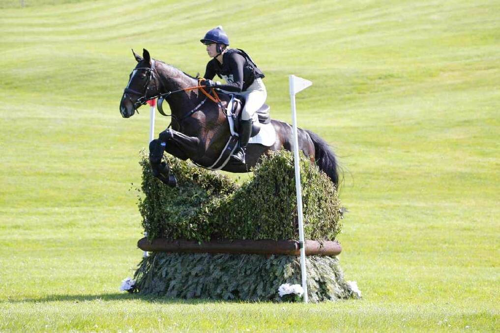 Kendall Dickinson takes part in a show jumping competition in the UK. Picture supplied