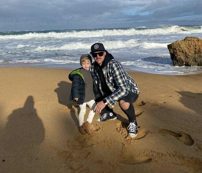 Shane and Bodhi Guthridge at the Hopkins River mouth before they were hit by a huge wave.