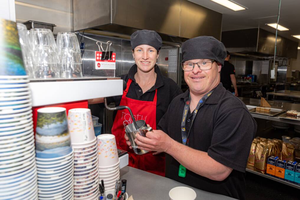 Drew Miller pictured working at Tasty Plate with chef Rhianna Bidmade. Picture by Eddie Guerrero 
