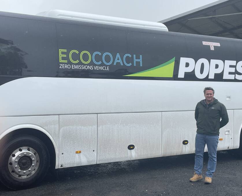 Popes Timboon director David Pope with the electric bus the company is trialling.