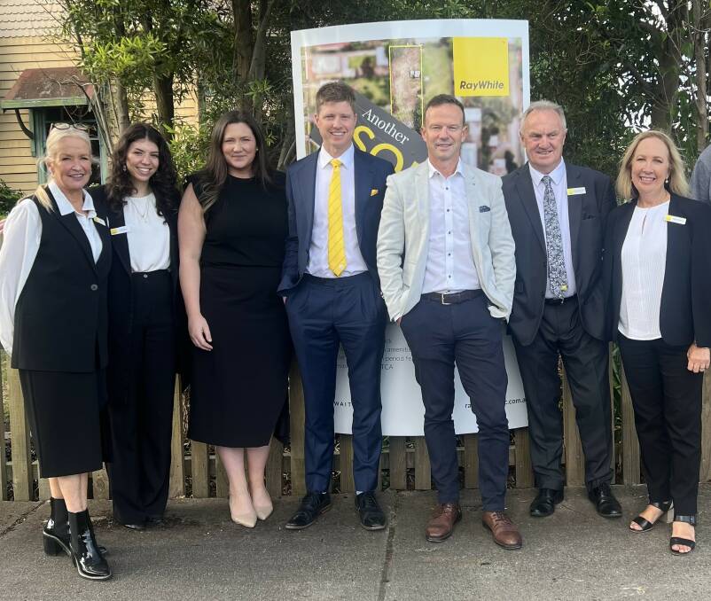 Fergus Torpy, centre, is pictured with the Ray White Colac team.