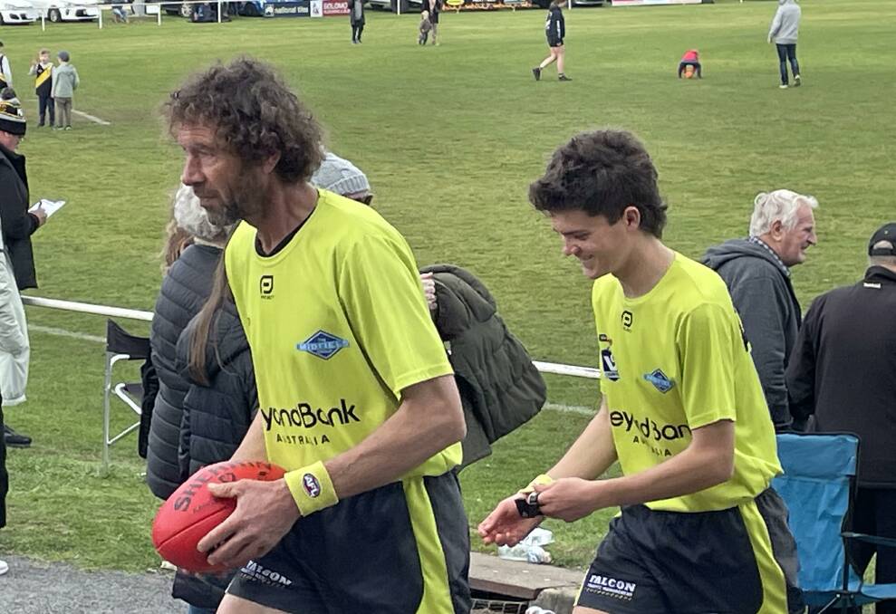 Central umpires Paul Schurring and Matt Gome leave the ground last Saturday after officiating in the reserves second semi-final.
