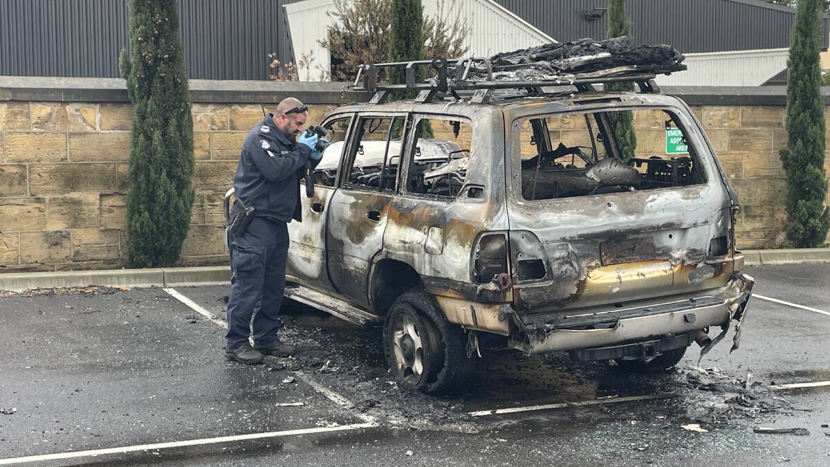 The torched LandCruiser in the St Joseph's church car park.