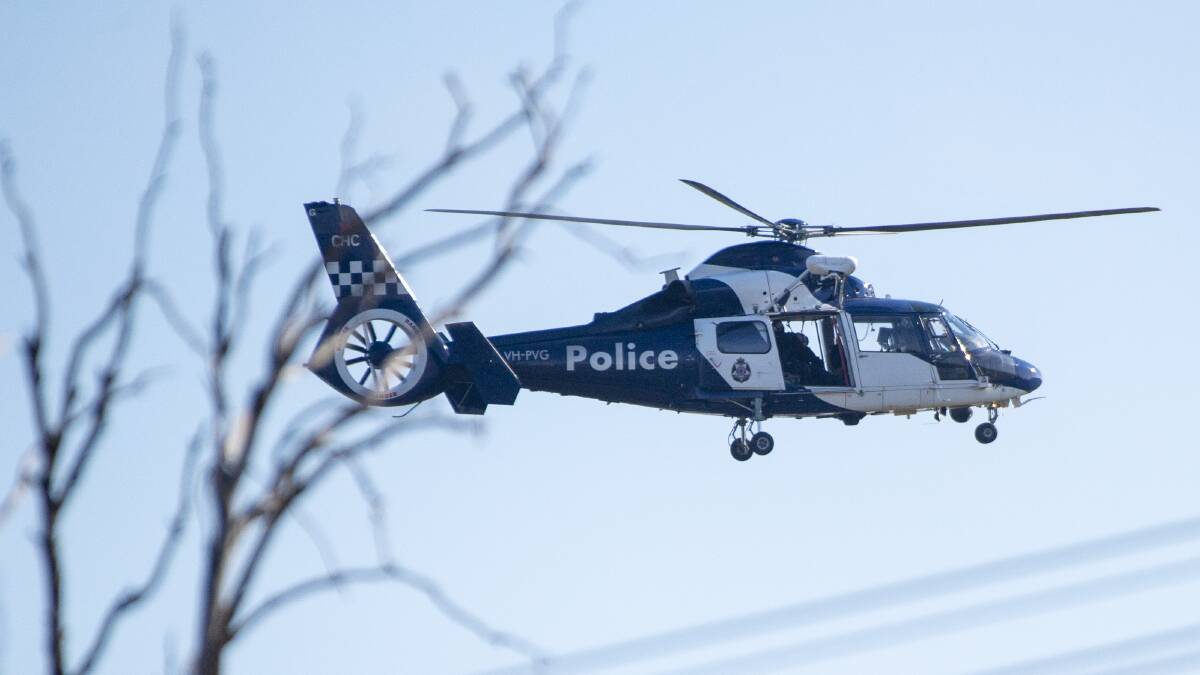 Manhunt: A Victoria Police heclicopter was involved in the search for a wanted Warrnambool man on Sunday afternoon. This is a file image.