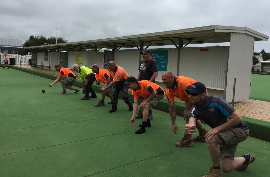 Getting ready: Tradies working on Port Fairy Bowls Club's upgrade enjoy a bowl. They're in training for the Tradies Challenge.