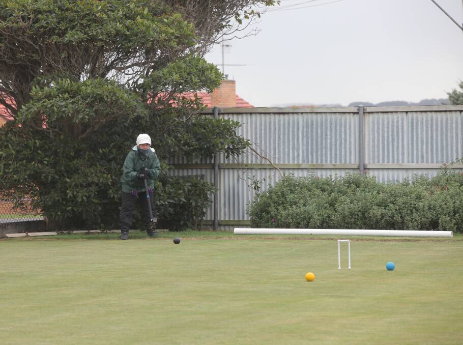 Where will it stop?: Drysdale's Fay Harrison watches her shot during the Warrnambool Croquet Club's inaugural golf croquet tournament. Picture: Brian Allen