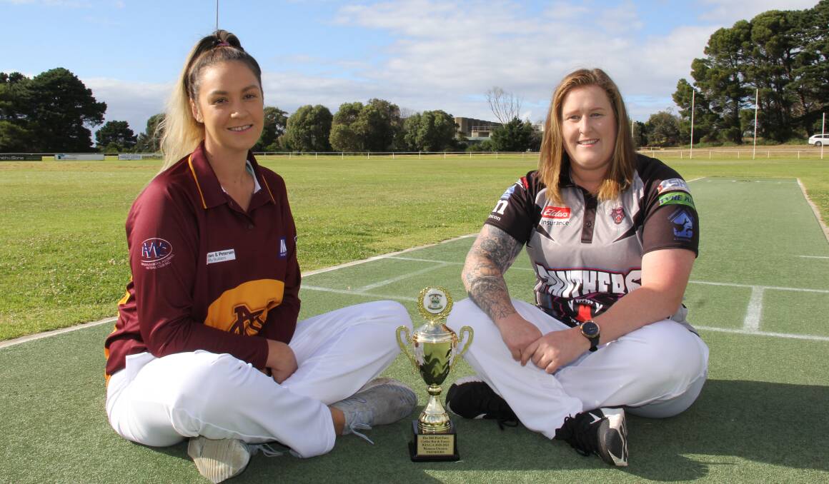 Grand final: Nestles vice-captain Brooke Herbertson and West Warrnambool's Jasmine Bowater with the premiership trophy. Picture: Brian Allen