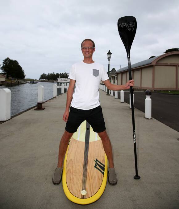 Quest: Dustin Neate is one of 200 people registered to participate in Australia’s largest ever Stand Up Paddle event in Melbourne on Saturday. His partner Chelsea and son Jack, 14 months, will be there to cheer him on. Picture: Amy Paton