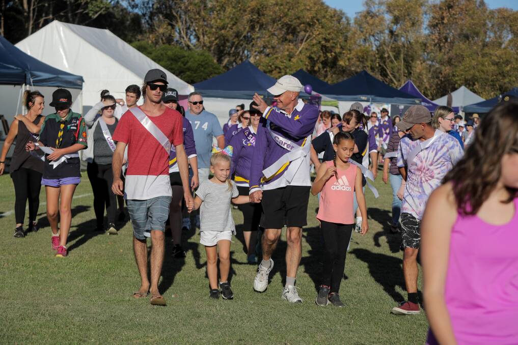 Relay For Life Warrnambool participants walk around the Deakin University oval at a previous event. This year's relay is on Saturday from noon to 10pm.