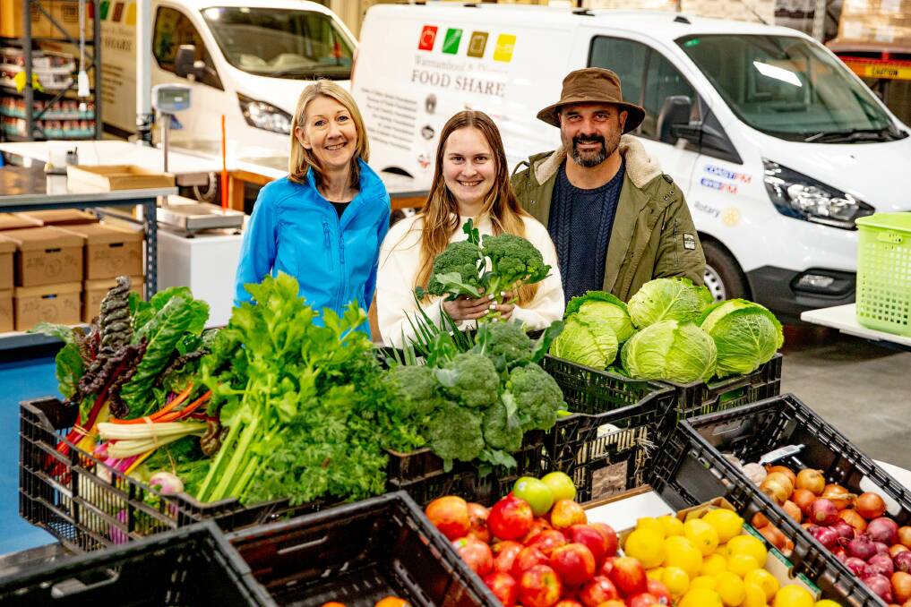  Warrnambool and District Food Share chief executive officer Amanda Hennessy with Georgia and Ben Pohlner of Volcano Produce. 