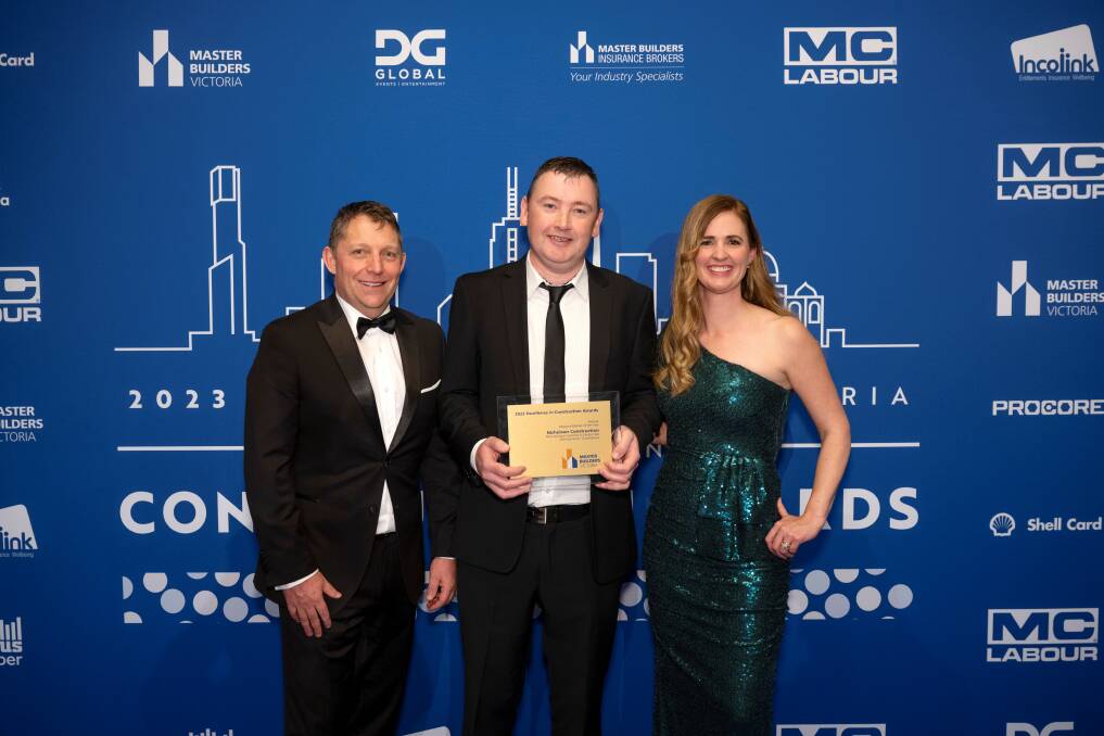Master Builders Victoria president Geoff Purcell (left) and CEO Michaela Lihou (right) with Nicholson Construction director Paul Toy (centre) after winning the Western Regional Commercial Builder of the Year award in Melbourne on Friday night. The firm was recognised for its work on the Warrnambool Learning and Library Hub. Picture supplied Ned Meldrum