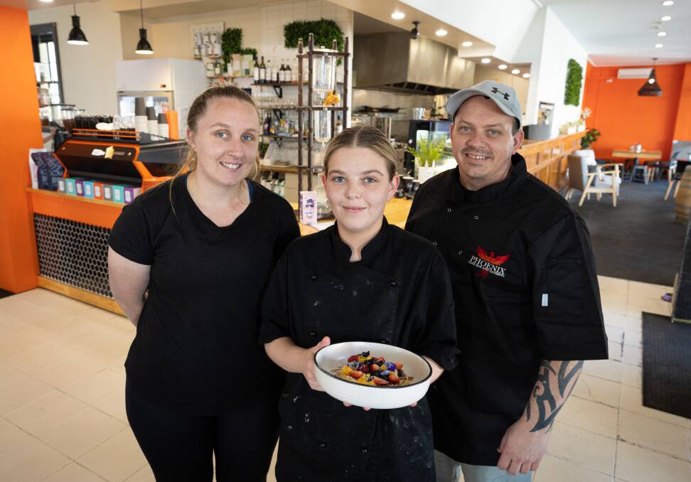 Phoenix Cafe Bar and Catering team members Anita Drury and Caitlin Harradine and owner Mark Mitchell will close its doors to cater for the May Racing Carnival. Picture by Sean McKenna