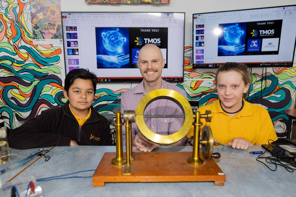 Warrnambool Primary School students Jermaine Chand and Evie Hollonds with Australian Research Council's Centre of Excellence for Transformative Meta-Optical Systems member Ben Russell. Picture by Anthony Brady