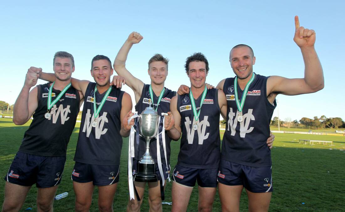Winners are grinners: Milestone man Tim O'Keeffe (second from right) celebrating Warrnambool's 2012 HFNL grand final victory with Damien McCorkell, Darcy Graham, Jed Turland and Travis Graham.
