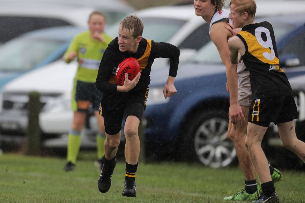 Changes coming: Portland's Thomas Sharkey sets off along the boundary line. The Great South West Junior Football League will start next year. Picture: Rob Gunstone