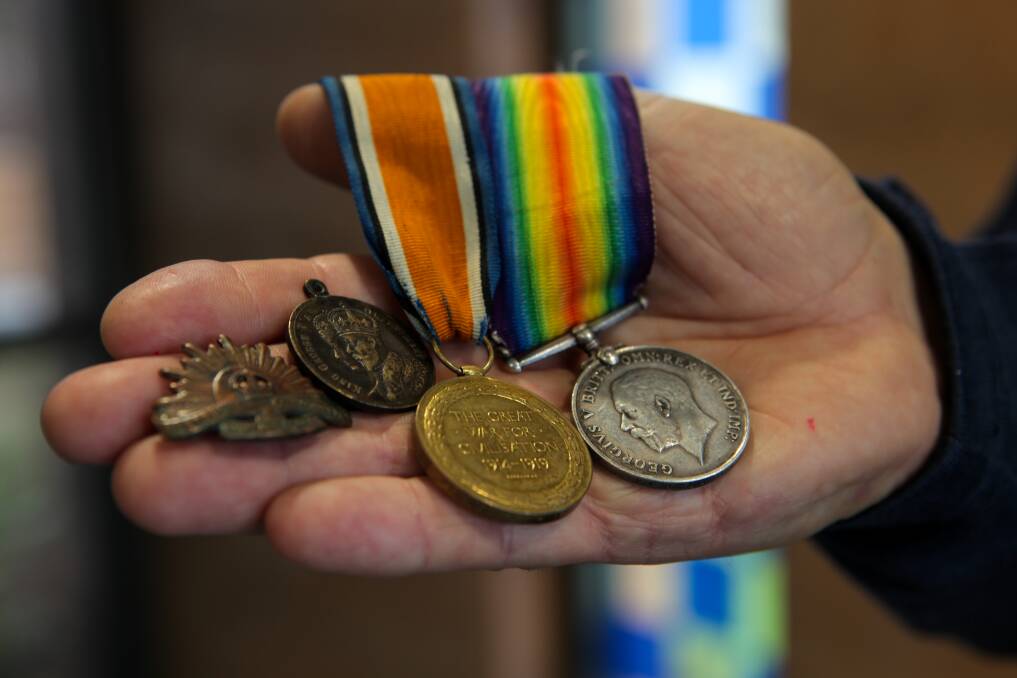 Medals: Alfred Oats' British war medal from 1914-1920, a victory medal, Coronation of King George V medal and Rising Sun slouch hat pin, all of which were stolen from grandson Geoff De La Rue's home. Picture: Rob Gunstone