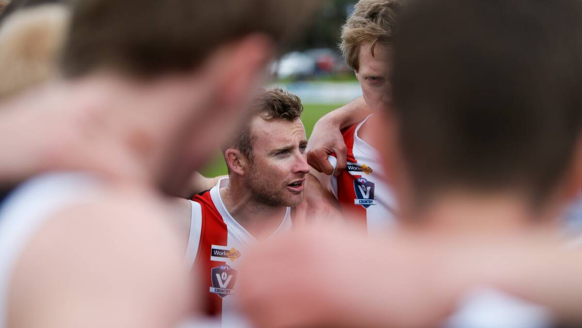 SKIPPER'S SAY: Koroit's Brett Harrington speaks to his players in the final huddle before last year's grand final. Picture: Morgan Hancock