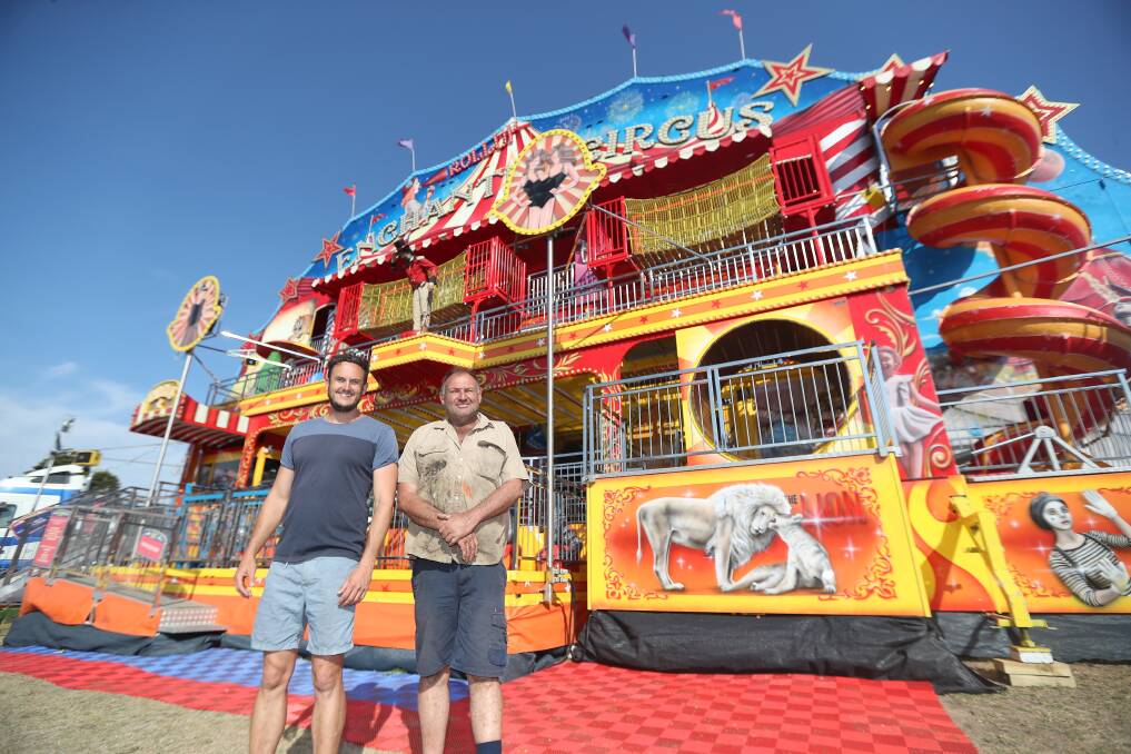 NEW RIDE: Carnival Owner Emile Verfurth with stepson Trent Woodall (left) in front of the new ride the Enchanted Circus. Picture: Mark Witte