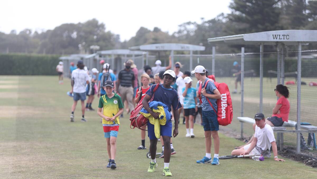 Break in play: A group of juniors walk off after being delayed by the heat rule. Picture: Mark Witte
