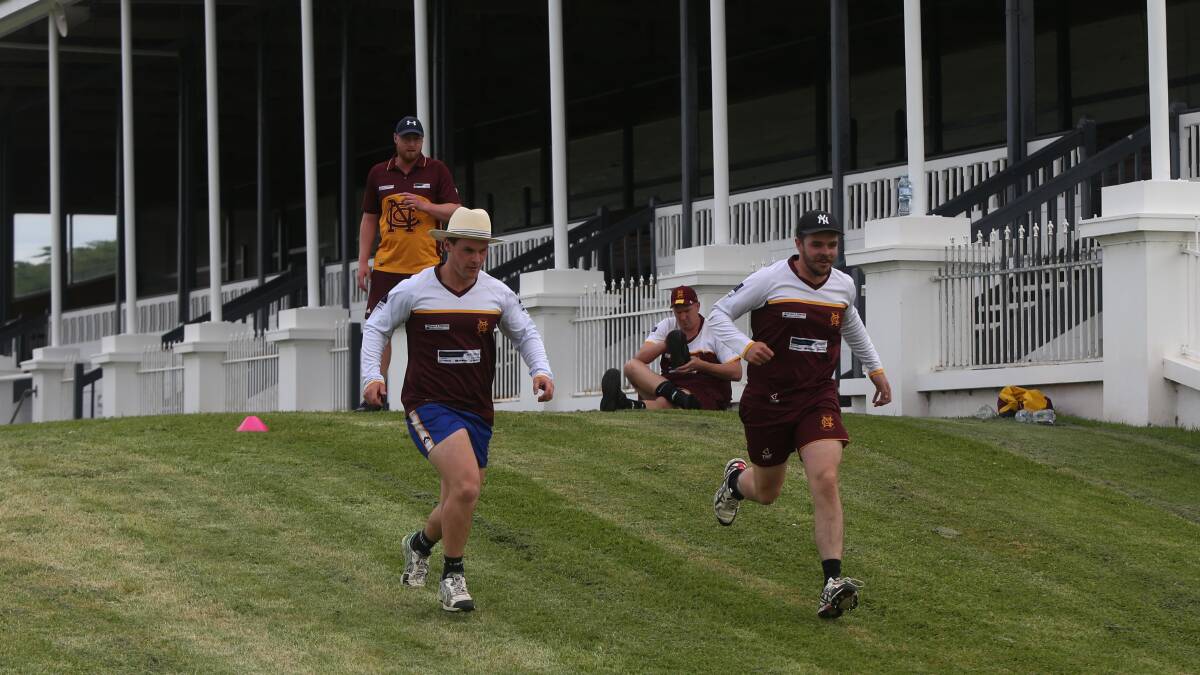 KEEPING FIT: Nestles' Jacob Pope and Ryan Hetherington do hill runs in front of the stands at the Warrnambool Racing Club. Picture: Mark Witte
