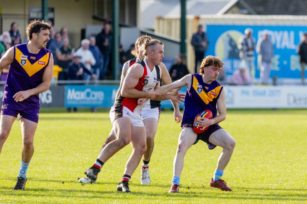 Koroit's Will Couch tackles Port Fairy's Segdae Lucardie at Gardens Oval. Picture by Anthony Brady 