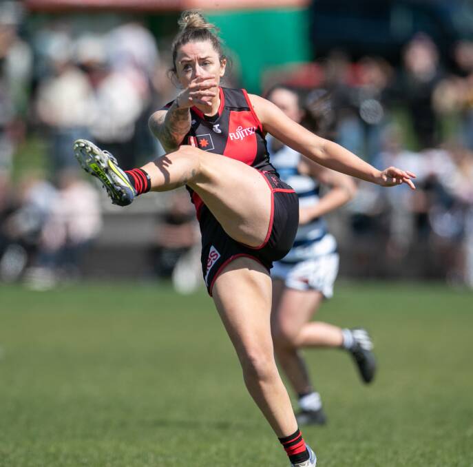 Essendon footballer Jessica Wuetschner kicks the Bombers into attack. Picture by Sean McKenna