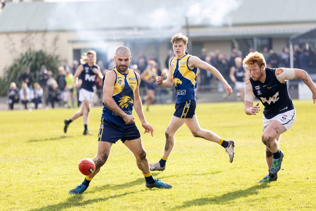 North Warrnambool Eagles' Reece Scoble and Warrnambool's Harry Ryan chase after the ball. Picture by Anthony Brady 