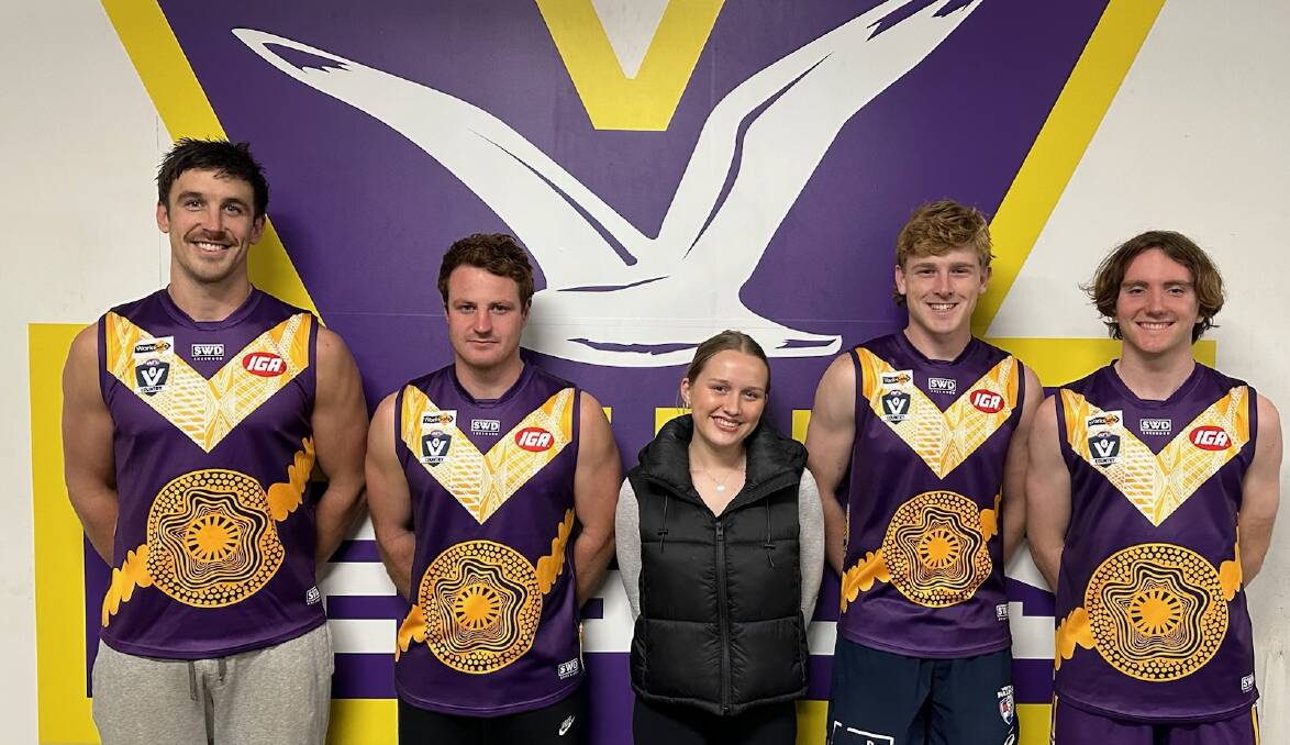 Guernsey designer Amelia Bell (middle) with Port Fairy footballers Matt Sully, Kaine Mercovich, Oscar Pollock and Segdae Lucardie who will wear the special jumper on Saturday. Picture by Melissa Coffey 