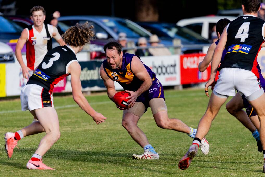 Port Fairy's Joel Moloney tries to evade Koroit opponents. Picture by Anthony Brady 