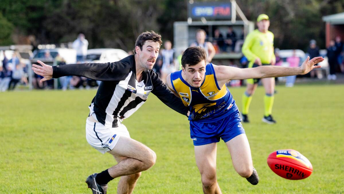 Camperdown's Matthew Field and North Warrnambool Eagles' Alex Jennings fly towards the ball. Picture by Anthony Brady 