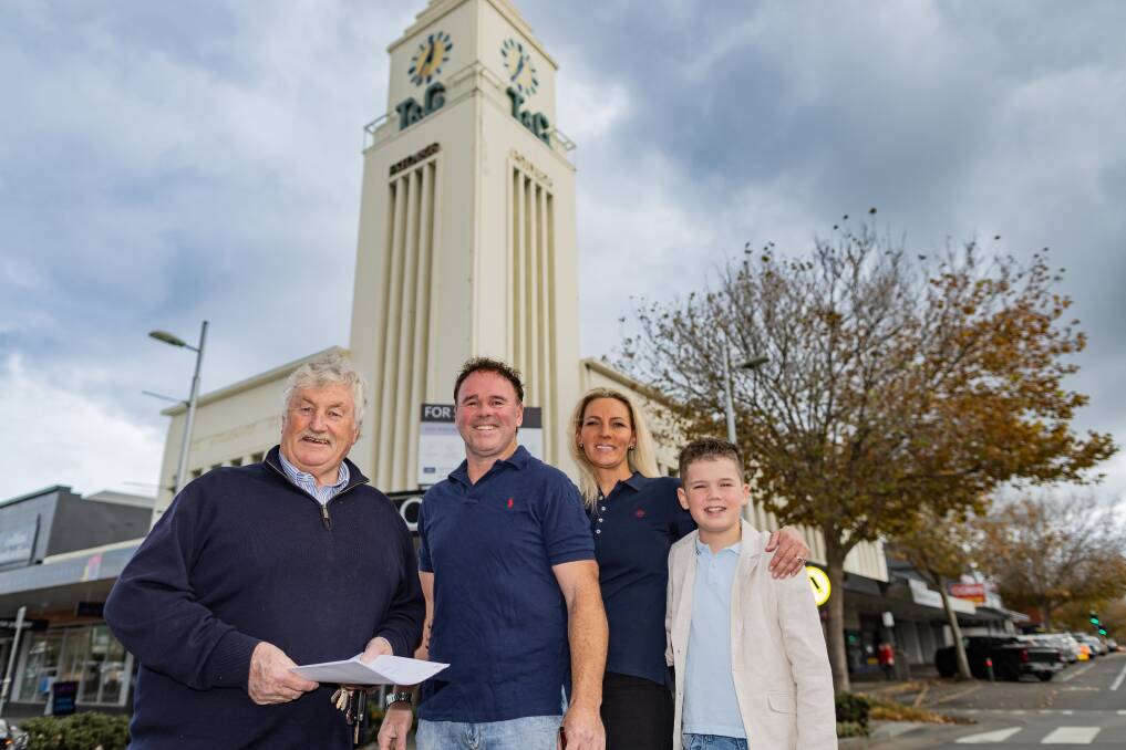 Real estate agent John Ryan with Clayton, Jacinta and Braxton Harrington. Harrington Property Group has purchased the T&G building in Warrnambool. Picture by Anthony Brady 