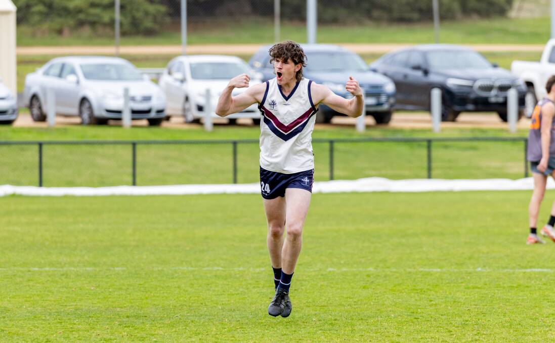 Ruckman Max Clancey celebrates a goal for Emmanuel College. Picture by Eddie Guerrero 