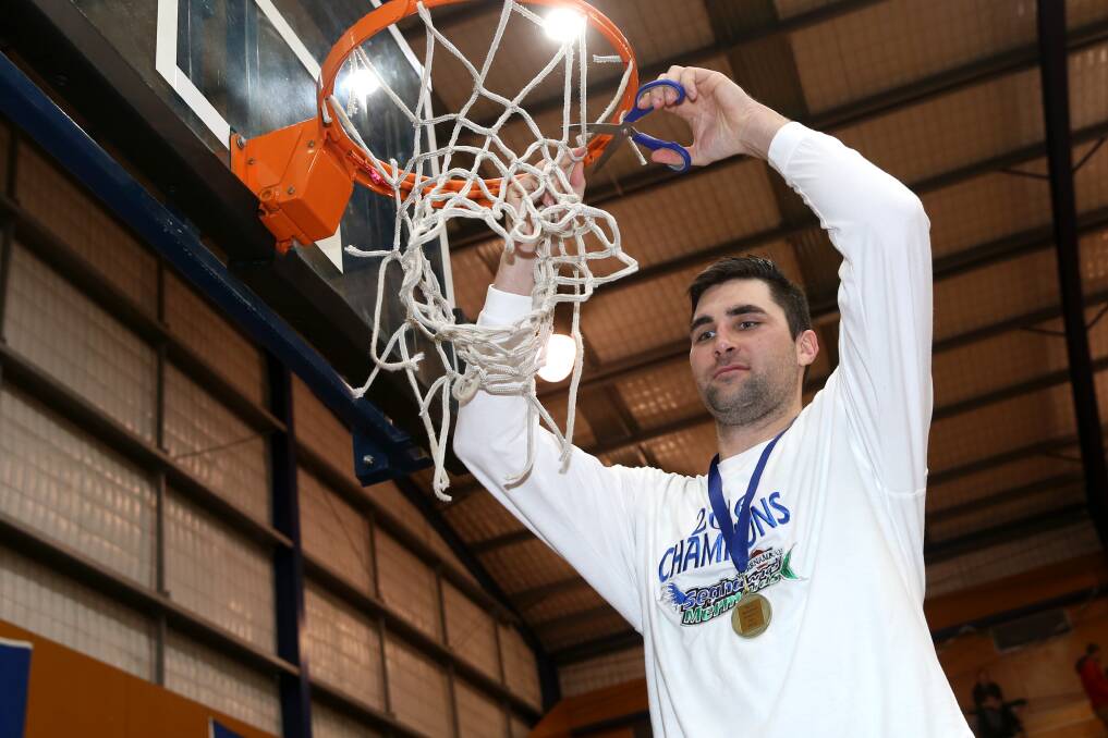 Alex Gynes cuts down the net after Warrnambool Seahawks' 2016 championship win. File picture 