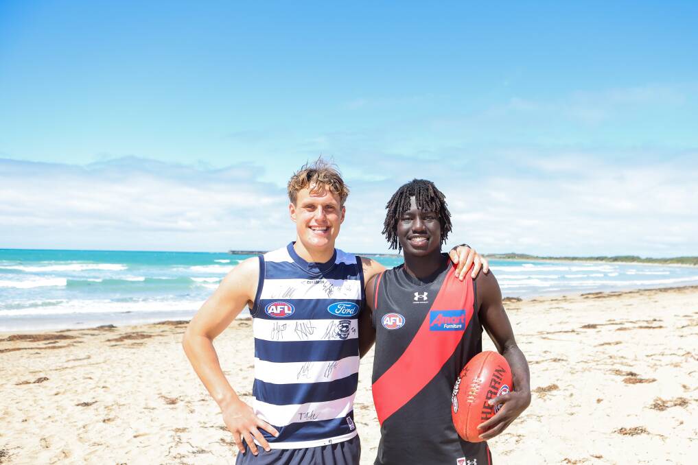 From Warrnambool to the AFL, new Geelong midfielder George Stevens and new Essendon defender Luamon Lual get acquainted with their new colours. Picture by Anthony Brady 