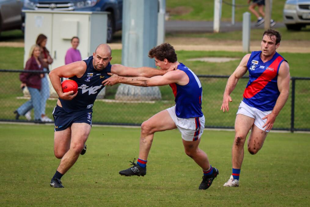 Warrnambool's Ben Cunnington uses a 'don't argue' against Terang Mortlake. Picture by Justine McCullagh-Beasy 