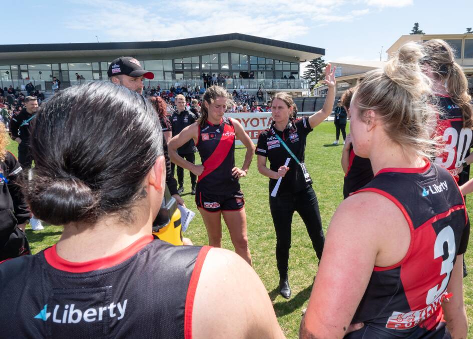 Natalie Wood - back in familiar territory at Warrnambool's Reid Oval - instructs her Essendon players during a break. Picture by Sean McKenna 