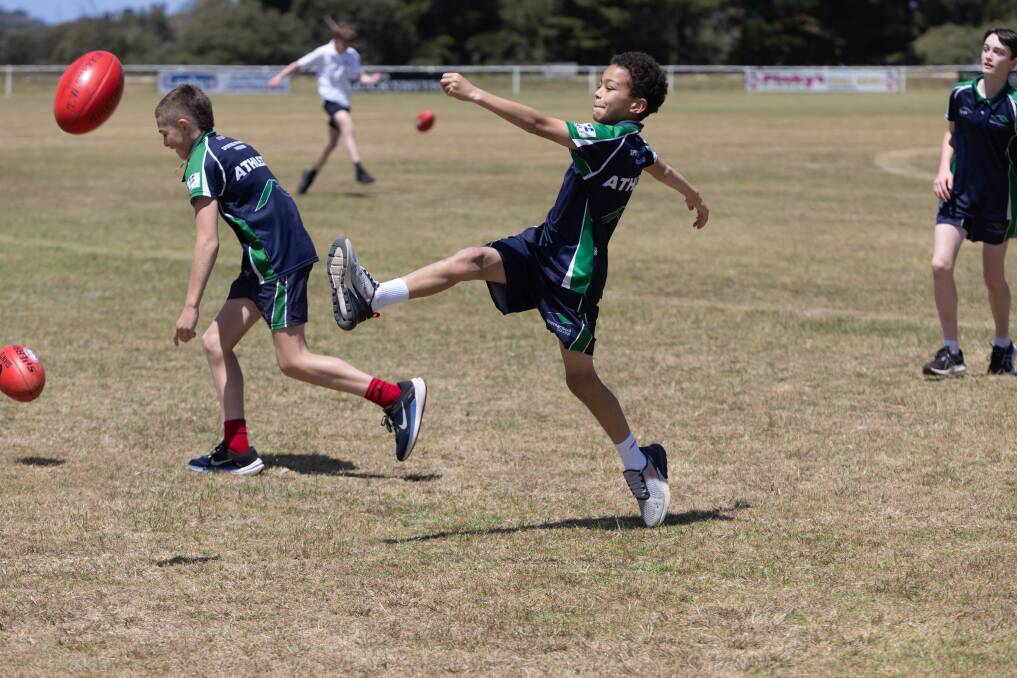 Warrnambool College student Amiyus Cunningham, 12, participates in the footy clinic at Mack Oval. Picture by Eddie Guerrero 