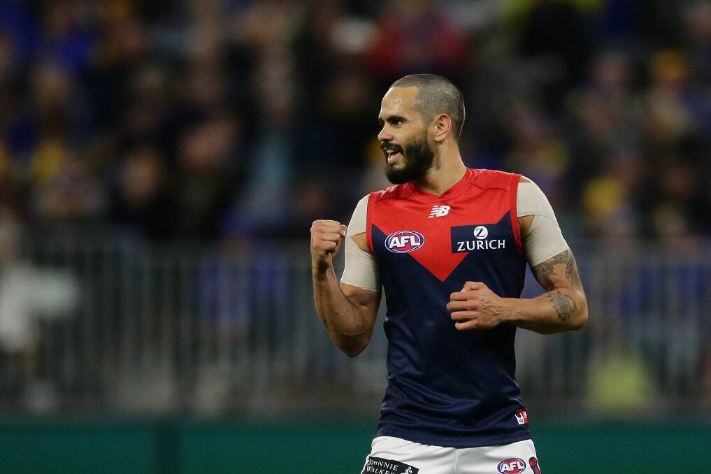 Jeff Garlett celebrates a goal for Melbourne during his stint with the Demons. Picture by Getty Images 