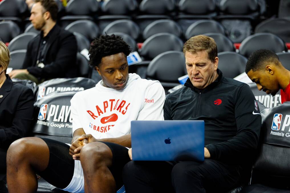Trevor Gleeson (right) talks about tactics with OG Anunoby during his stint with the Toronto Raptors. Picture supplied 