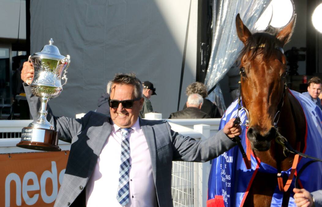 Trainer Lindsey Smith celebrates Tuvalu's win in the Toorak Handicap. Picture by Colin Bull 