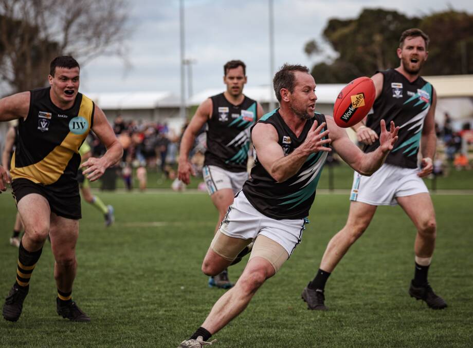 Joel Moloney gathers the ball for Kolora-Noorat during a WDFNL finals match against Merrivale in September 2023. Picture by Sean McKenna 