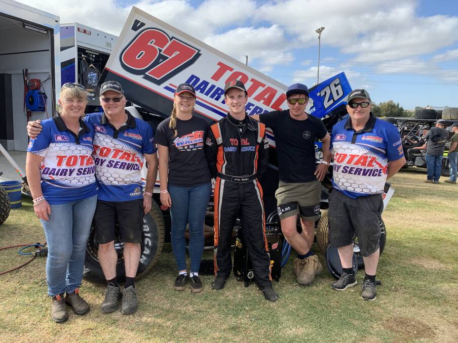 TEAM WORK: Timboon sprintcar driver Luke Walker (fourth from left) with Shirley Walker, Bevan Walker, Mikayla Hein, Ray Cole and Ian Vagg before a World Series Sprintcars meeting in January 2019. Picture: Justine McCullagh-Beasy
