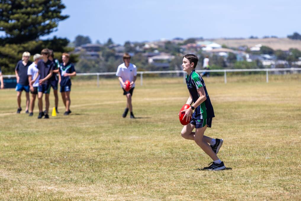 Warrnambool College student Sonny Hussey, 12, participates in the footy clinic at Mack Oval. Picture by Eddie Guerrero 