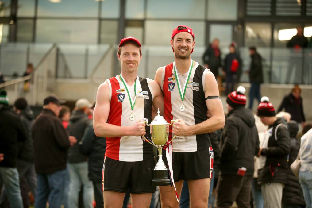 Dallas Mooney and Jeremy Hausler after the Saints' 2022 grand final win. File picture 