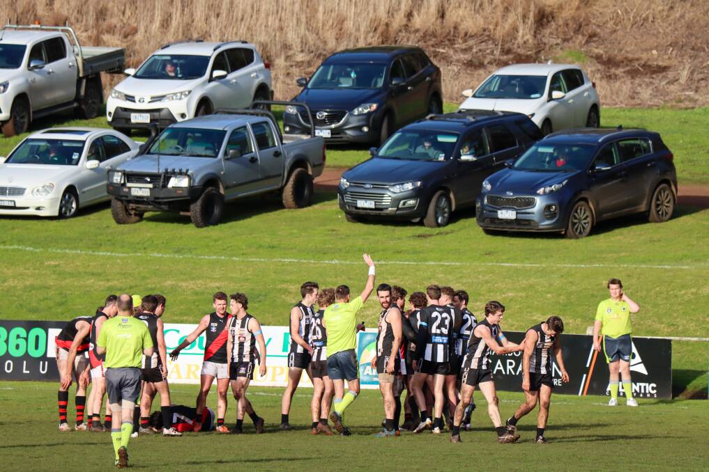 Cobden's Patty Smith (on the ground) and Camperdown's Charlie Lucas (far right) were hurt when they clashed in round 14. Picture by Justine McCullagh-Beasy
