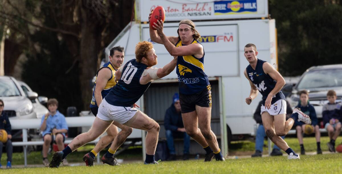 North Warrnambool Eagles play-maker Jett Bermingham weaves through traffic against Warrnambool on Saturday. Picture by Anthony Brady 