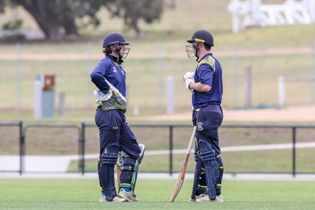 Warrnambool and District's Bailey Jenkinson and Theo Opperman talk tactics at Reid Oval. Picture by Eddie Guerrero 